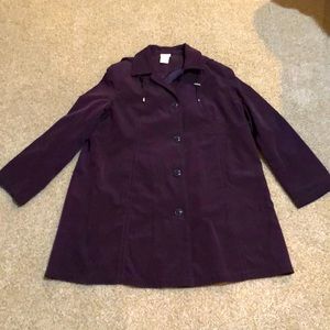 Norm Thompson lined coat. Coated back sheds rain